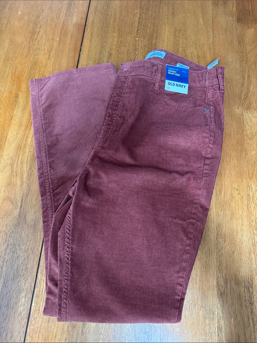 Old Navy NWT women’s boot cut, rust colored corduroy pants.